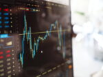 Blue and yellow graph on stock market monitor