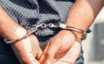 Close up photography of a person in handcuffs